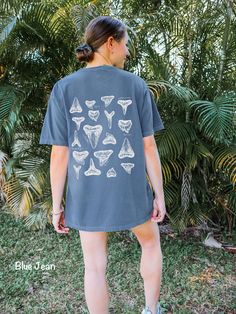 This Respect the Locals Shark Tooth Shirt is printed on a Comfort Colors tee. These tee's are made with 100% ring-spun cotton, giving them a soft and relaxed fit. Perfect for a beach day hunting sharks teeth! Details - made with 100% ring-spun cotton - soft-washed, garment-dyed fabric for soft color and texture - double-needle stitching throughout tee for durability SHIPPING Production time can take 2-7 business days, although the average time is 2.9 days Shipping times in the US is 2-5 business days. *shipping to Alaska, Hawaii, Puerto Rico and unincorporated territories of the US can take an additional 7-12 business days. RETURNS Each shirt is Print-on-Demand, meaning it is not created until you order. Therefore, returns and exchanges are not accepted unless a product arrives damaged. If Respect The Locals Shark, Shark Clothes, Tooth Shirt, Respect The Locals, Sharks Teeth, Shark Lover, Beach Tee, Shark Shirt, Trendy Beach