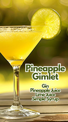 the pineapple gimlet cocktail is garnished with a slice of lime