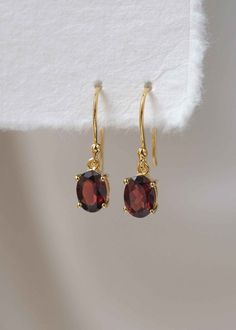 Our Garnet Dangle Earrings in gold vermeil are just the right size to be noticed and small enough to wear all day comfortably. The stone is a large 8mm natural deep red genuine Garnet popular as a January birthstone. Also available in sterling silver, see earrings section. Sold as a pair, comes with extra silicone ear backs to keep them secure.DETAILS• Dimensions: 8mm x 6mm, total length - 24mm• Material: 18k gold vermeil over 925 sterling silver base, genuine Garnet• Birthstone month - January Classic Gold Plated Earrings As Gift, Gold Drop Earrings With Birthstone, Classic Birthstone Drop Earrings, Elegant Gold-plated Birthstone Earrings, Elegant Gold Plated Birthstone Earrings, Classic Gemstone Earrings Perfect As Gifts, Classic Gemstone Earrings As Gift, Classic Gemstone Earrings For Gift, Gold Plated Birthstone Dangle Earrings