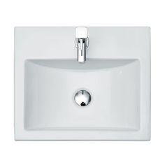 a white bathroom sink with chrome faucet and soap dispenser on the side