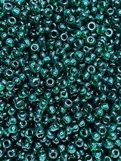 many green beads are shown in this close up photo