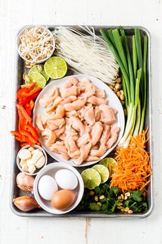 an assortment of food is displayed on a tray