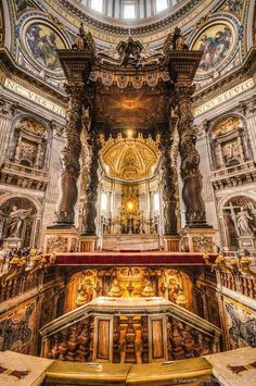 the inside of a church with many paintings on the walls and ceiling, including an ornate alter