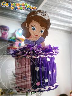 there is a cake made to look like princesses in the room with other children