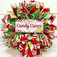 a candy cane christmas wreath on a white background with the words candy canes printed on it