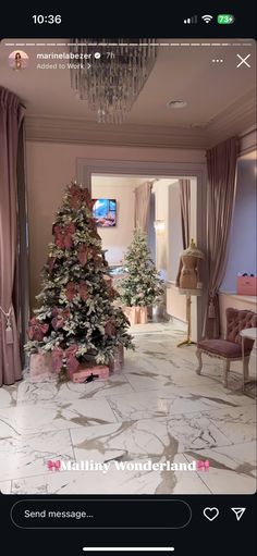 a decorated christmas tree sitting in the middle of a living room