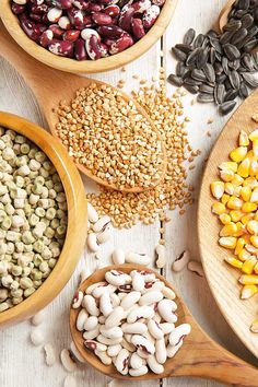 several bowls filled with different types of beans