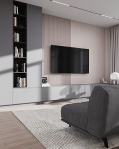 a large flat screen tv mounted to the side of a wall in a living room