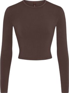 Trendy Fitted Plain Tops, Fitted Basic Plain Tops, Trendy Solid Snug Fit Tops, Trendy Snug Fit Solid Color Tops, Trendy Snug Fit Solid Top, Solid Crew Neck Top With Thumbholes, Fitted Brown Crew Neck Top, Basic Long Sleeve Fitted T-shirt, Basic Fitted Long Sleeve T-shirt