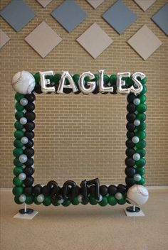 an eagle balloon frame with baseballs and balloons