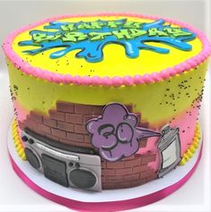 a birthday cake decorated with an image of a cartoon character on the front and side