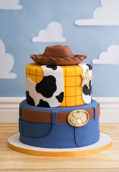 this is a cake made to look like a toy story woody the cowman costume