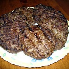 the steak has been cut into pieces and served on a white plate with yellow flowers