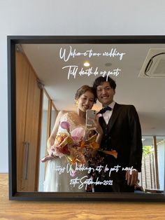 a man and woman standing next to each other in front of a mirror with the words, when at first we see nothing