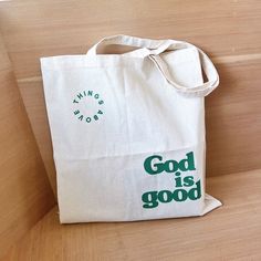 "God is Good Tote Bag | Bible Tote | Christian Tote Bag | Christian gift | Bible Verse Christian Canvas Tote Bag | Christian Bible Bag Hi, Welcome to Things Above! We sell Christian based apparels and tote bags that are comfortable, soft and in high quality. If you have any questions at all feel free to message us! We look forward to make you and your loved ones happy and satisfied. * If you would like to have a customized design or color, send us a message! Our designer will be happy to help you. ⟡ Product Description ⟡ *  6.0 oz 100% cotton canvas *  Folds flat *  Size: 14 1/2\" x 15 1/2\" ⟡ Care Instructions ⟡ * Wash item inside out in cold water * Do not bleach * DO NOT TUMBLE DRY!! * Do not dry cleaning * Do not iron directly on the design ⟡ Production and Shipping ⟡ *  Processing is Green Bag With Letter Print For Gift, Green Letter Print Bags As Gifts, Christian Tote Bags Paint, Eco-friendly Green Bag With Letter Print, Eco-friendly Green Bags With Letter Print, Bible Bags Totes Diy, Christian Tote Bag Design, Christian Totes, Christian Bags