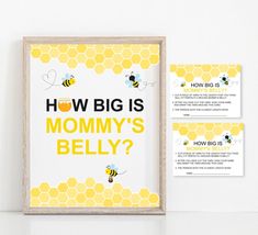 a bee themed baby shower is displayed in front of a white wall with the words, how big is mommy's belly?