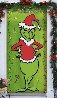 the grinch door cover is decorated with christmas decorations