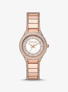 Dazzling and dainty, the mini Sylvia watch is sure to make a statement. Defined by a rose gold-tone stainless steel polished strap, this opulent timepiece features a pearlescent dial adorned with glittering pavé accents. Level up the shine by teaming it with sparkling accessories to match. Elegant Rose Gold Diamond Watch With Diamond Hour Markers, Classic Rose Gold Diamond Watch With Polished Finish, Elegant Rose Gold Watches With Rhinestones, Michael Kors Rose Gold Jewelry With Metal Dial, Michael Kors Rose Gold Analog Watch, Rose Gold Watches Women, Michael Kors Outlet, Stainless Steel Polish, Sales Gifts