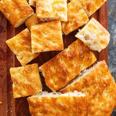 slices of cheesy bread on a cutting board