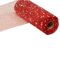 a roll of red fabric with white speckles on the top and bottom half