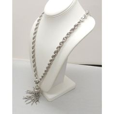 This is part of Chairish’s Costume Jewelry assortment.  Rhodium plated tassel pendant necklace with fold over clasp. Marked "Monet." From Monet's Damita line which was produced from 1960 through the 1970s. Measures 15 inches long total. Pendant with bale measures: 3 3/4 inches long by 1 inch wide. Chain doubled measures: 11 3/4 inches. Excellent condition. A goldtone version of this necklace is shown on pg. 186 of Alice Vega's book "Monet: The Master Jewelers." Elegant Metal Jewelry With Tassels, Elegant Metal Tassel Jewelry, Silver Dangle Necklace With Detachable Pendant, Silver Dangle Jewelry With Tassels, Silver Necklace With Detachable Dangle Pendant, Luxury Dangle Tassel Jewelry, Elegant Silver Rope Chain Necklace, Elegant Silver Necklace With Rope Chain, Elegant Silver Metal Tassel Necklace