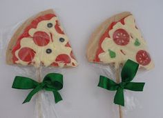 two pizza shaped lollipops are wrapped in cellophane and tied with green ribbon