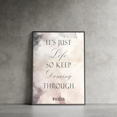 a poster with the words it's just life so keep going through, on a wall