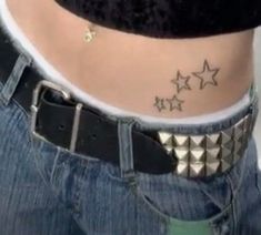 a woman with three stars on her stomach