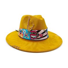 Have you been fascinated by the colorful outfits of the ethnic people in some remote areas when they were featured on your local TV channel? This is now your chance to add that fashion in your attire because Innovato Design has another find that you surely don't want to miss – this handmade  exquisite Cotton  Fedora Hat. The rich, luxurious suede material not only looks and feels exceptional but also offers durability and comfort.  The standout feature of this hat is the monochrome hatband, which adds a touch of contrast and flair, making it a versatile accessory suitable for various occasions. Whether you're dressing up for a special event or looking to enhance your everyday look, this handcrafted fedora hat effortlessly complements your style. Its classic fedora shape offers a timeless a Trendy Yellow Festival Hat, Yellow Bohemian Fedora Hat, Yellow Bohemian Hat With Flat Brim, Yellow Bohemian Adjustable Hat, Dolphin Bracelet, Wood Inlay Rings, Sports Couples, Colorful Outfits, Punk Accessories