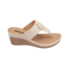 Get versatile appeal with GC Shoes' Genelle wedge sandal. Its leather top and faux wooden bottom create a modern look that adds a pop of fun to any outfit. Plus, the footbed has extra cushioning for all-day comfort. Never having to sacrifice style for comfort. Perfect for staying stylish and comfortable on the go. Comfortable Leather Toe Post Wedge Sandals, Beige Wedge Sandals With Arch Support And Round Toe, Modern Wedge Sandals With Textured Footbed, Modern Wedge Sandals With Textured Footbed And Round Toe, Modern Wedge Sandals With Cushioned Footbed For The Beach, Modern Wedge Sandals With Arch Support For Beach, Modern Beige Wedge Sandals For Beach, Modern Beige Wedge Sandals With Round Toe, Modern Beach Wedge Sandals With Leather Footbed