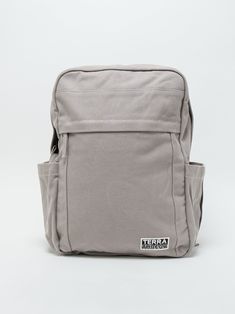 Need a backpack that's both sustainable and practical for college, school everyday use or outdoor activities? Our Earth Backpack is perfect for you. Our spacious and durable Earth Backpack is the workhorse of our line, built for everyday carry with heavy-duty certified organic cotton canvas. The generous main compartment is divided with a no-fuss sleeve for your laptop and one small interior pocket to keep things organized. Two water bottle sleeves and the large zippered exterior pocket keep hyd Functional Gray Backpack For Everyday, Functional Everyday Gray Backpack, Everyday Functional Gray Backpack, Durable Functional Backpack For Everyday Use, Gray Backpack For Everyday Use And Back To School, Durable Everyday Functional Backpack, Durable Functional Everyday Backpack, Versatile Everyday Durable Bag, Versatile Durable Backpack For Everyday Use