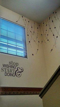 the inside of a building with a sign and window above it that says, stop wishing start & doing