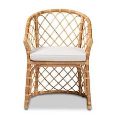 a wicker chair with a cushion on the back and seat padding, in front of a white background