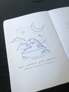 an open notebook with writing on it and a drawing of the moon in the sky