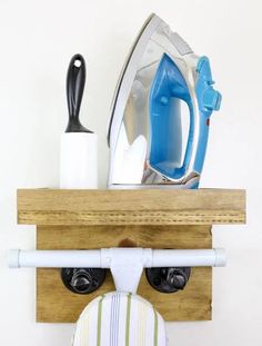 an ironing board with a face made out of clothes hanging from it's sides