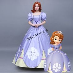 there is a figurine of a princess next to a doll in a dress