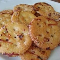 some crackers are sitting on a white plate