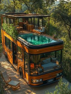 an orange bus with a hot tub in the middle of it's roof is parked on a wooden platform