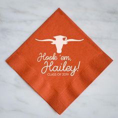 an orange napkin with the words hoole'em, hailey class of 2013 printed on it