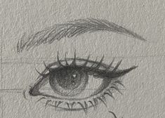 a pencil drawing of an eye with long lashes and eyelashes on the outside of it