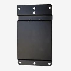 a black metal plate with holes on the front and back of it, against a white background