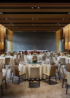 a large banquet room with tables and chairs