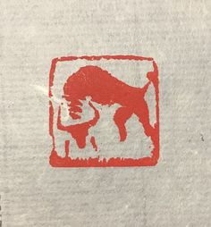 a red buffalo sticker on a white box