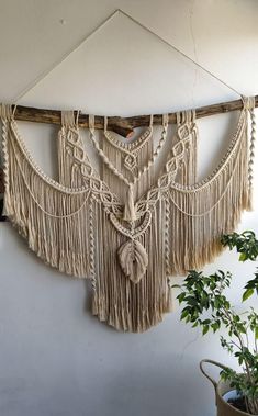 a wall hanging made out of macrame and rope