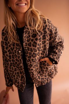 Leopard print, long sleeve bomber-jacket that features a slightly loose fit, as well as silvery snap buttons and two pockets on the front. This jacket offers lining and has elastic on the bottom of the waist to cinch and tighten. Throw this statement jacket on to complete any outfit no matter the occasion. Trendy French/Parisian women's winter fashion - DESIGNED IN FRANCE Fitted Leopard Print Winter Outerwear, Chic Leopard Print Long Sleeve Outerwear, Winter Leopard Print Outerwear With Faux Fur Trim, Leopard Print Faux Fur Coat, Fitted Leopard Print Faux Fur Outerwear, Statement Jacket, Parisian Women, Jacket Design, Office Outfits