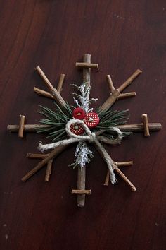 several pictures of christmas decorations made out of sticks and wood dows, including an ornament