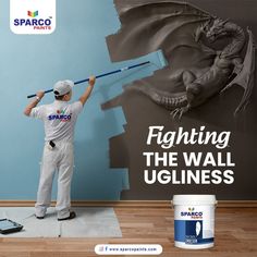 a man painting a wall with a paint roller and brush in front of an advertisement for sparo