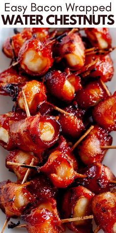 bacon wrapped water chestnuts on skewers with ketchup and toothpicks