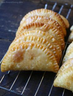 four pastries sitting on top of a cooling rack