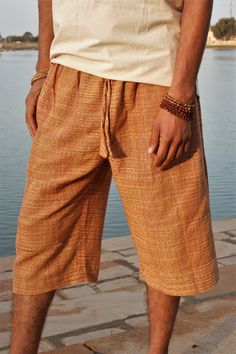 Casual and comfy knee-length pants/shorts made of natural *khadi cotton. For everyday use or yoga practice. COLOURS Orange-Brown (pic 1-2) Green-Brown (pic 3-4) SIZES One size - S/M - Around 90-95 cm around hips maximum for comfortable wear (the elastic will stretch out a bit with time) * Khadi is a traditional indian fabric made from handspun and handloomed cotton fibers. It is ethical guaranteeing the workers fair salarys, as well as eco friendly using only natural dyeing. Knee-length Cotton Bottoms For Beach, Cotton Knee-length Beach Bottoms, Knee-length Cotton Beach Bottoms, Brown Cotton Bermuda Bottoms, Brown Cotton Knee-length Shorts, Casual Knee-length Beach Pants, Knee-length Cotton Pants With Elastic Waistband, Relaxed Fit Knee-length Beach Shorts, Brown Cotton Knee-length Bottoms